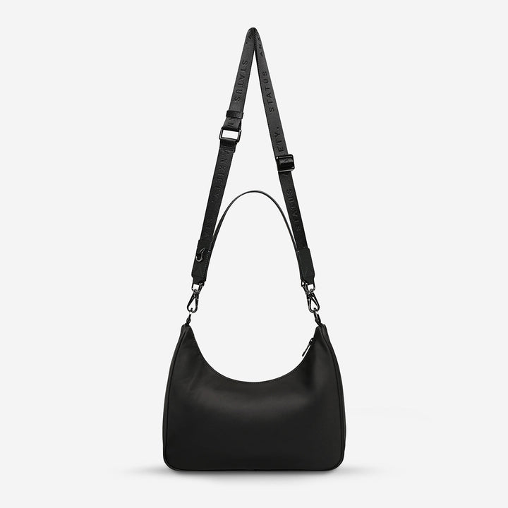 https://cdn.shopify.com/s/files/1/0214/8218/files/status-anxiety-bag-poly-fleur-black-back.jpg?v=1771287950