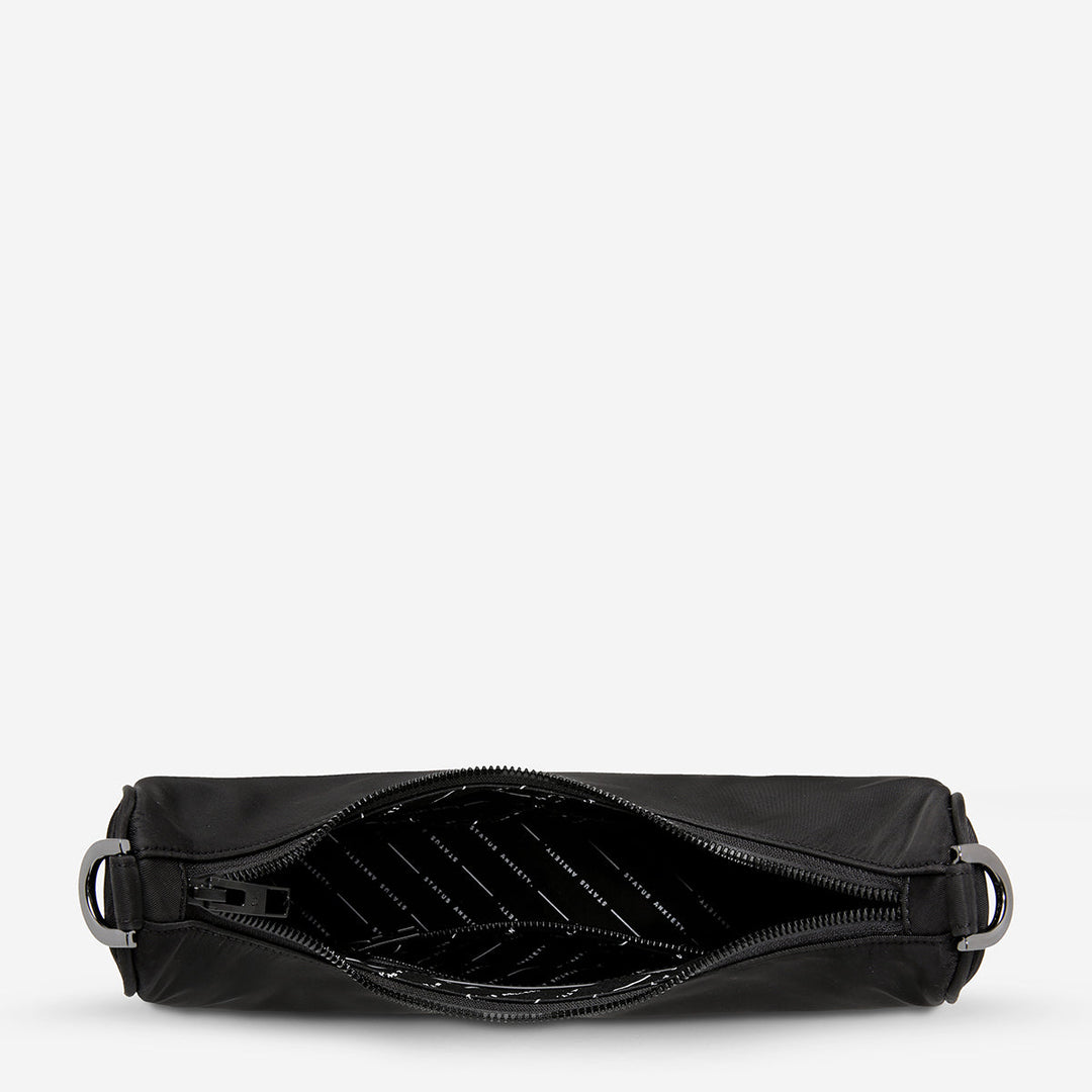 https://cdn.shopify.com/s/files/1/0214/8218/files/status-anxiety-bag-poly-fleur-black-open.jpg?v=1770763823