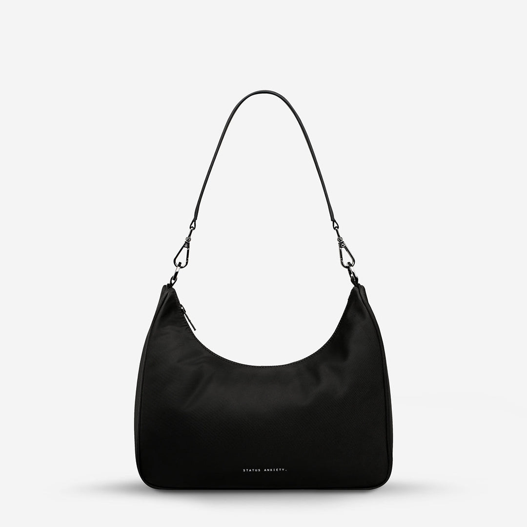 https://cdn.shopify.com/s/files/1/0214/8218/files/status-anxiety-bag-poly-fleur-black-short-strap.jpg?v=1771287950