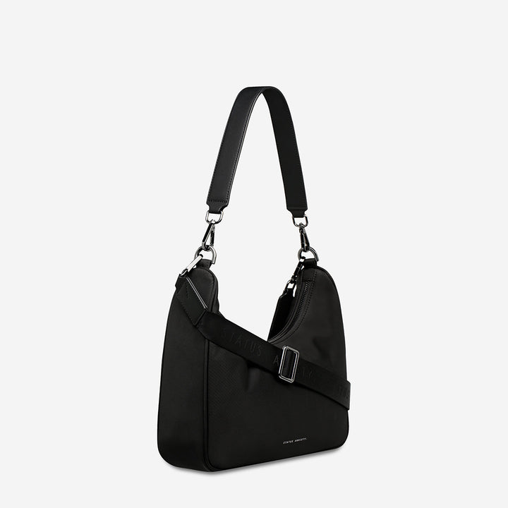https://cdn.shopify.com/s/files/1/0214/8218/files/status-anxiety-bag-poly-fleur-black-side.jpg?v=1770763823