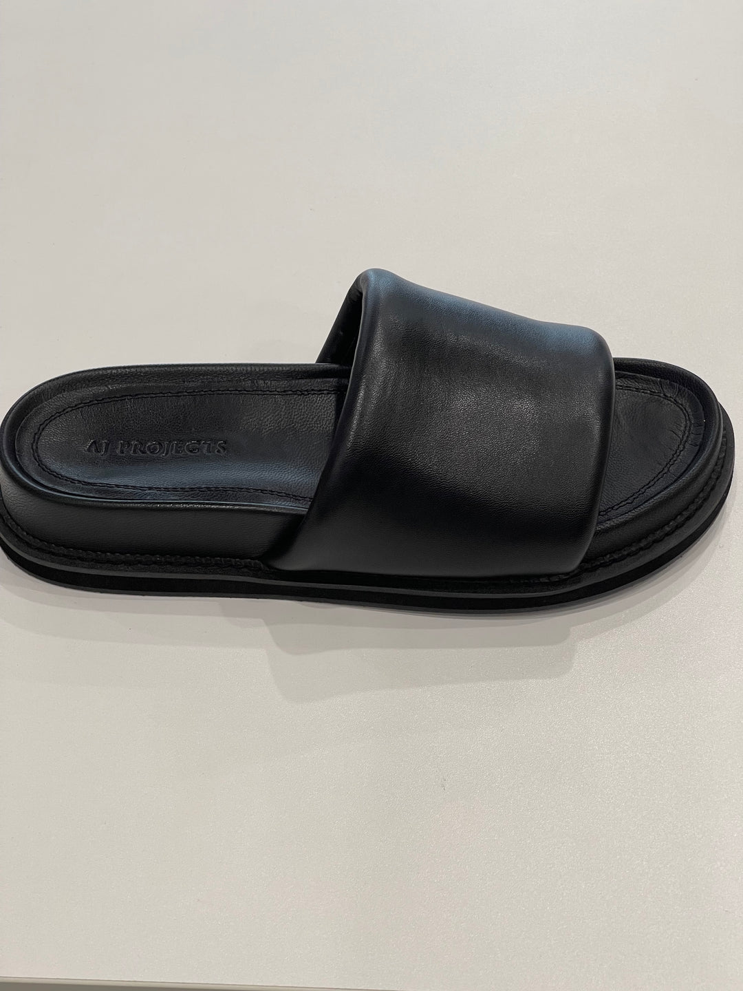Black Puffy Slides shoes AJ Projects   